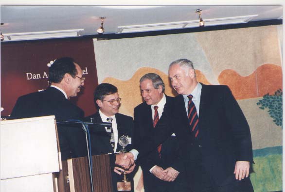 A photograph of Mr. Giora Shalgi and his collegues at RAFAEL meeting BiBi Netaniyahu