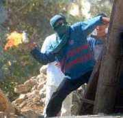 Intifadah: A Palestinian Throwing Molotov Coctails